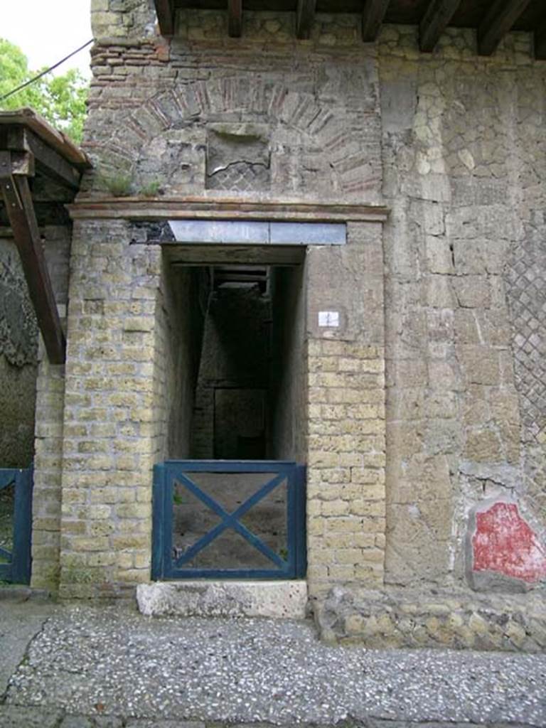 V.2 Herculaneum. May 2005.
Doorway to steps to upper floor, on east side of Cardo IV Superiore. Photo courtesy of Nicolas Monteix.
